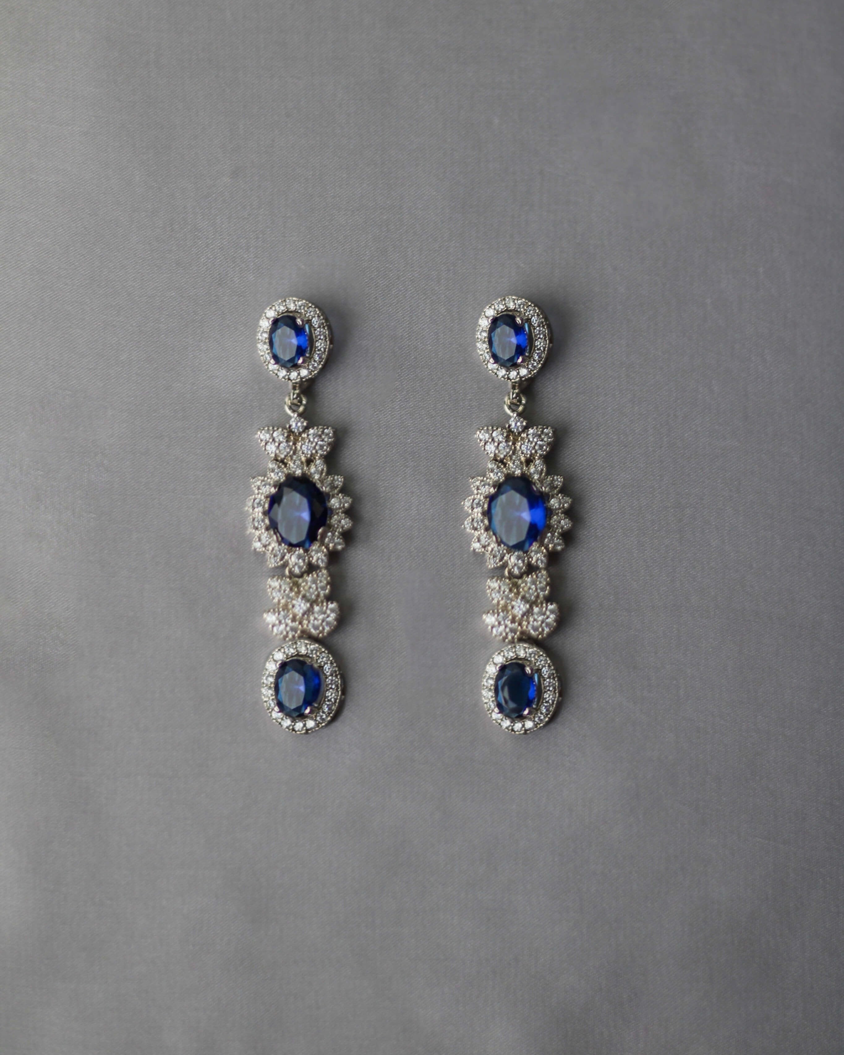 BLUE SAPPHIRE PEAR SHAPED DIAMOND LOOK DANGLERS – Sanvi Jewels